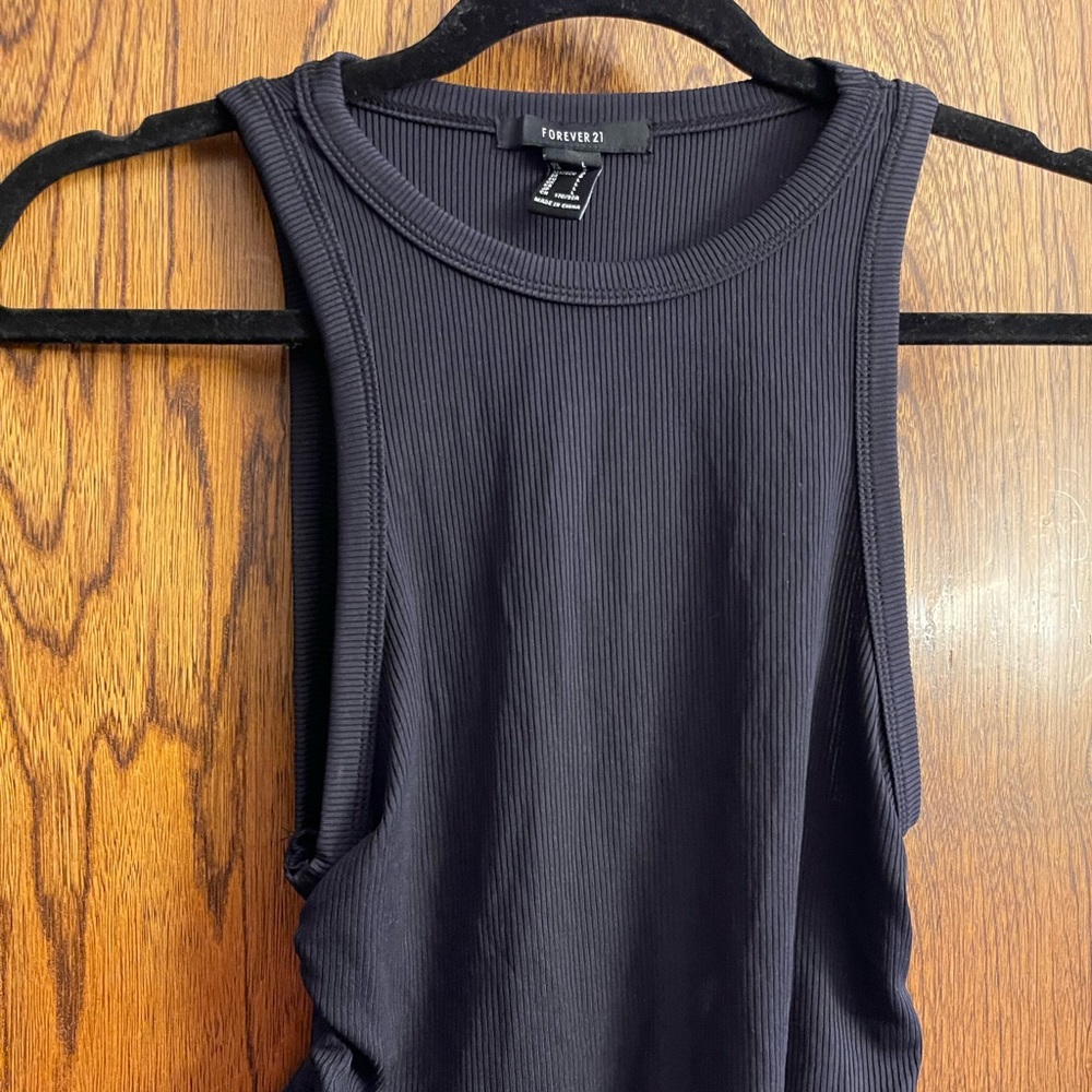 High neck black tank top with side ties.